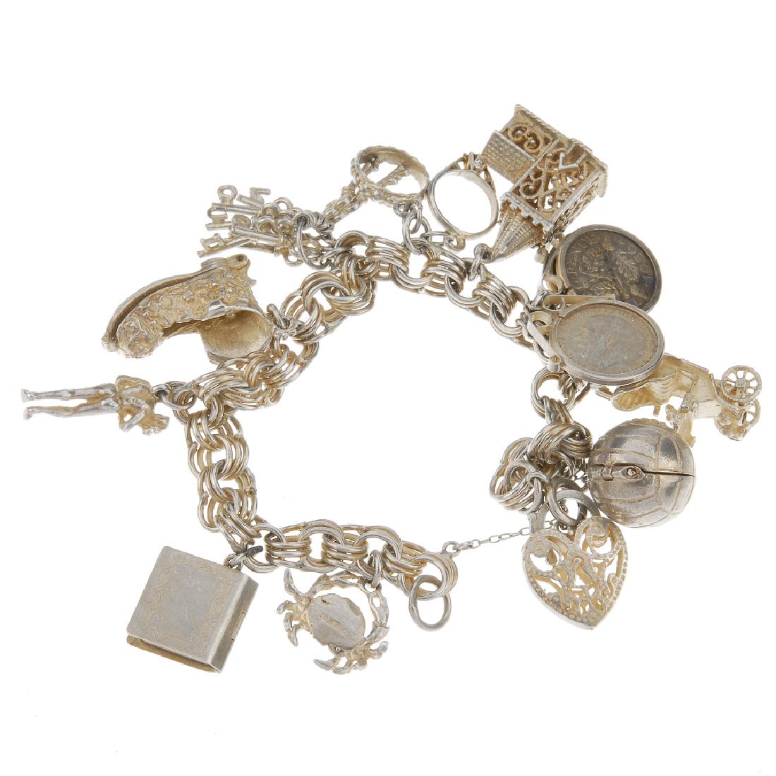 Two charm bracelets and two loose charms. One curb-link (1 of 2)
