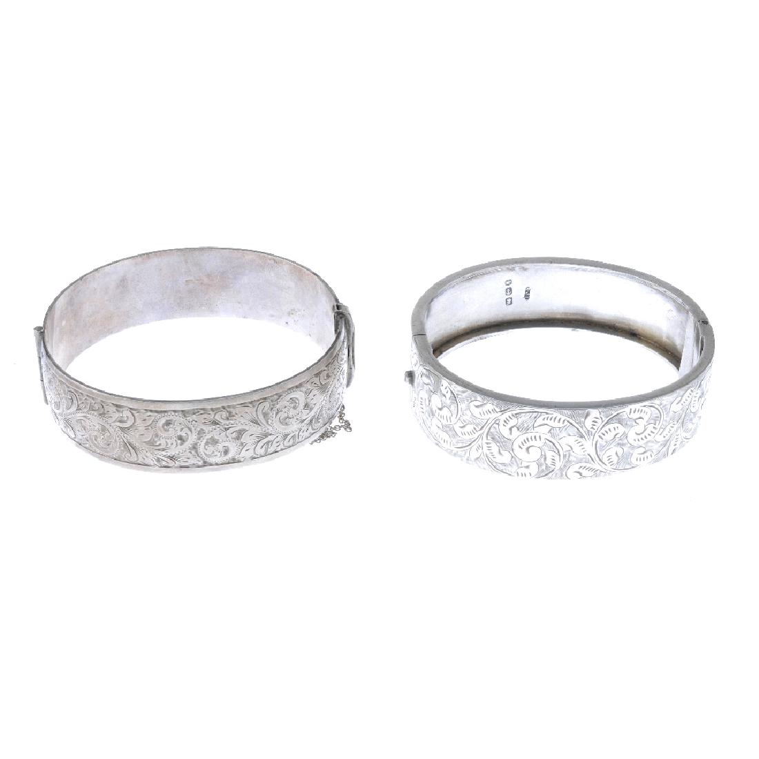 Four silver and white metal bangles. Two with acanthus (1 of 4)