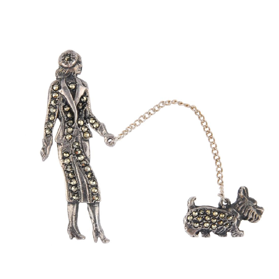 A marcasite brooch and dyed cultured pearl necklace.: A marcasite brooch and dyed cultured pearl necklace. The necklace a single row of dyed silver cultured pearls, fastening with two intersecting circles, the brooch designed in two sections, linked by a