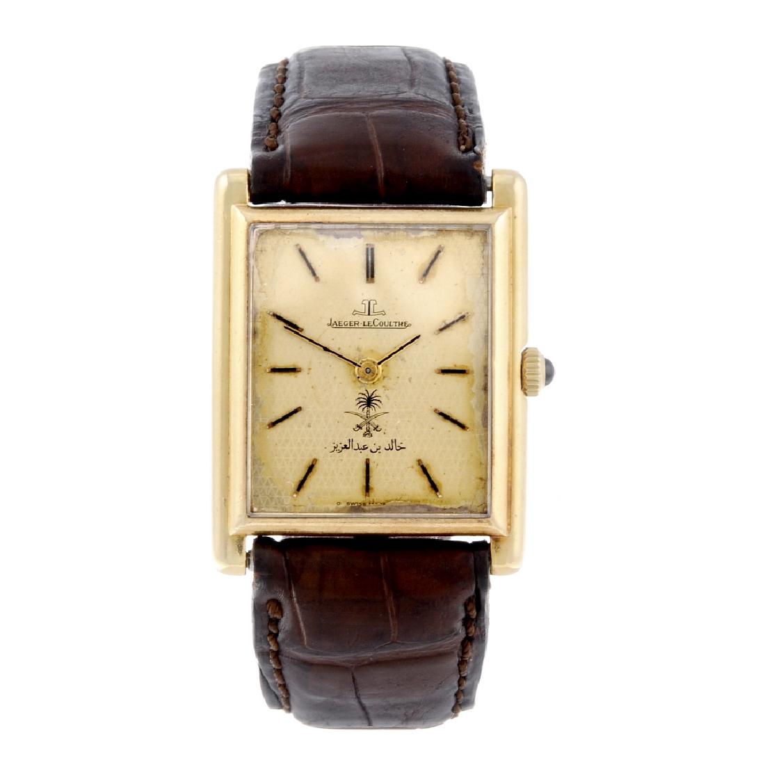 JAEGER-LECOULTRE - a gentleman's wrist watch. Yellow: JAEGER-LECOULTRE - a gentleman's wrist watch. Yellow metal case, stamped 18k 0,750 with poincon. Reference 6129.21, serial 1449338. Signed manual wind movement. Champagne dial with baton hour markers,