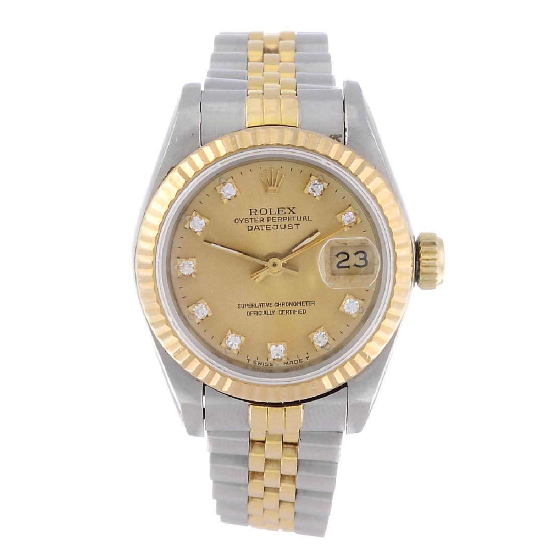 ROLEX - a lady's Oyster Perpetual Datejust bracelet: ROLEX - a lady's Oyster Perpetual Datejust bracelet watch. Circa 1989. Stainless steel case with yellow metal fluted bezel. Reference 69173, serial L343043. Signed automatic calibre 2135 with quick da