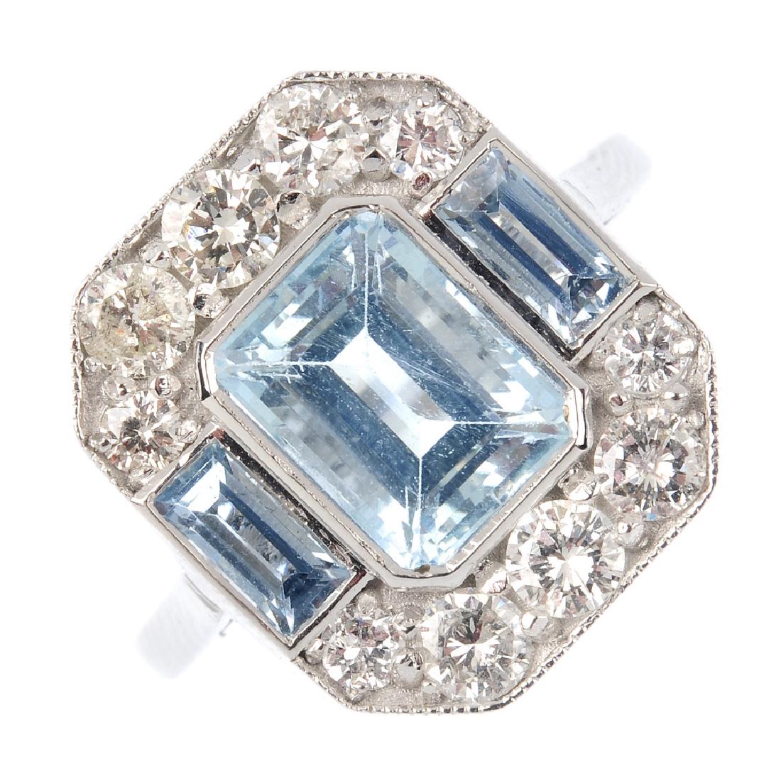 An aquamarine and diamond cluster ring. The (1 of 4)