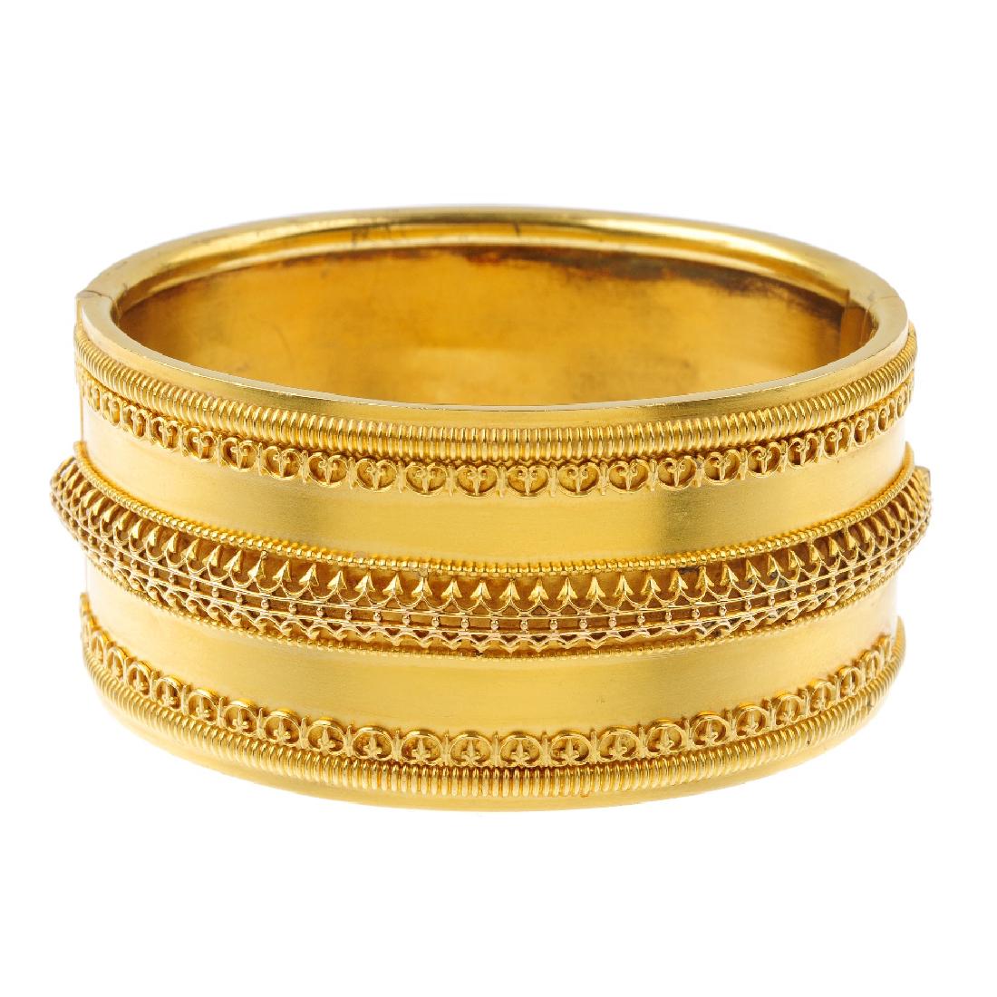A late Victorian 18ct gold bangle. Comprising three (1 of 2)