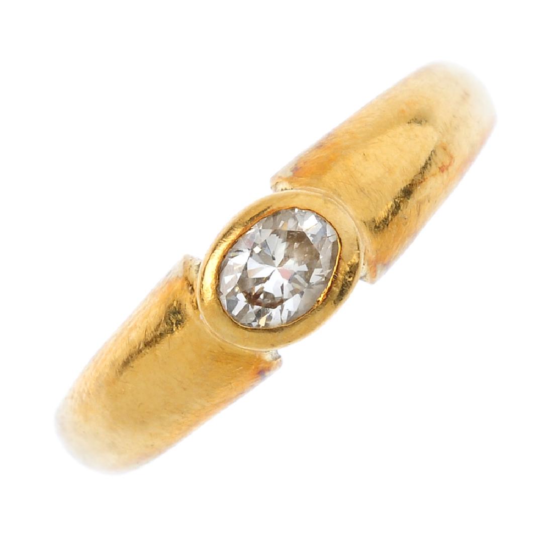 A diamond single-stone ring. The oval-shape diamond (1 of 3)