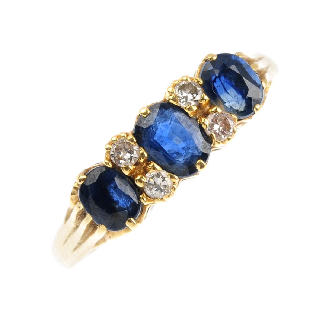 An 18ct gold sapphire and diamond ring. Comprising (1 of 3)