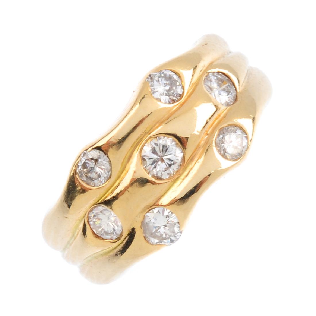 A diamond dress ring. Designed as a series of (1 of 3)