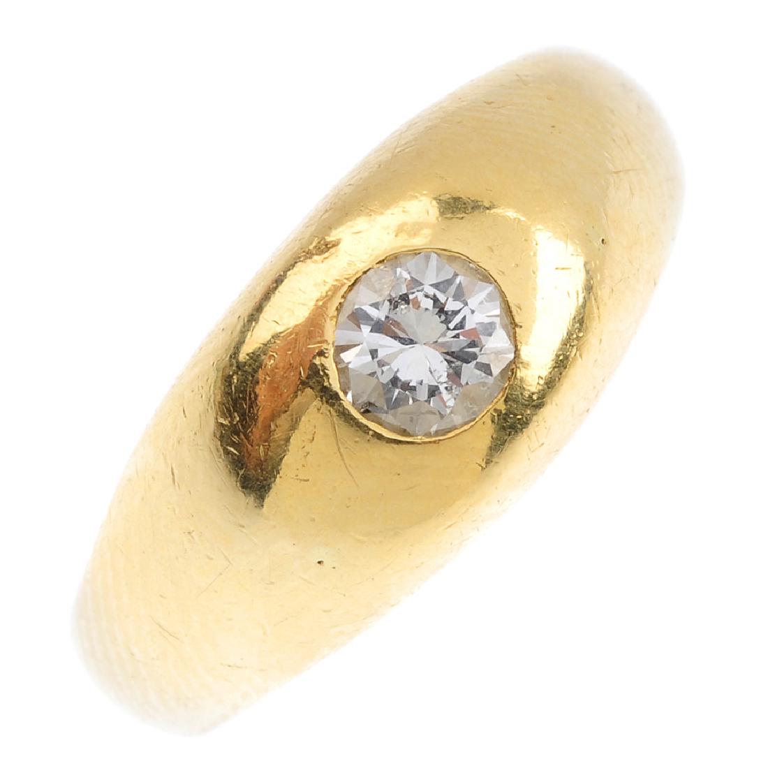 An 18ct gold diamond ring. The brilliant-cut diamond, (1 of 3)