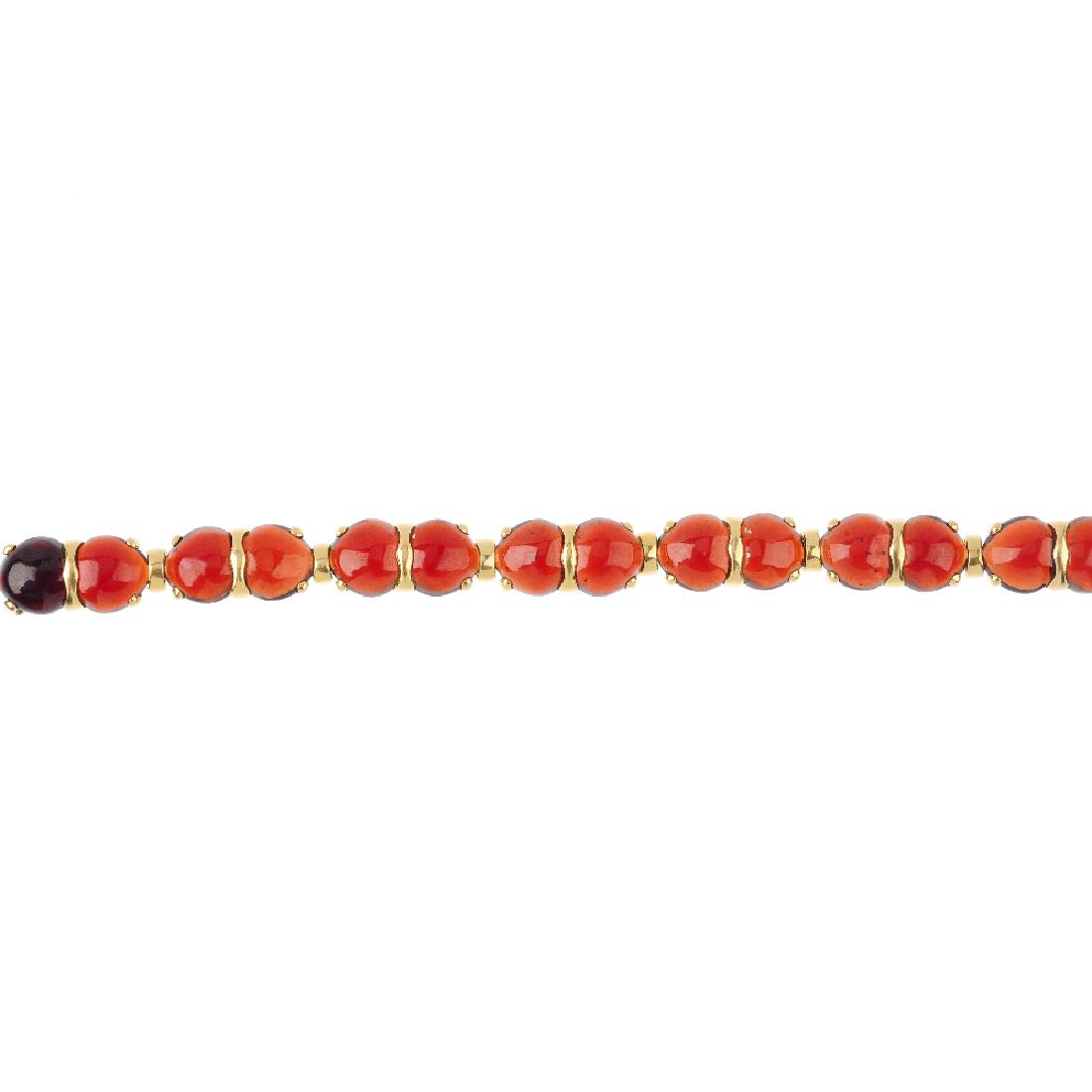 (548952-5-A) An 18ct gold garnet bracelet. Designed as (1 of 3)