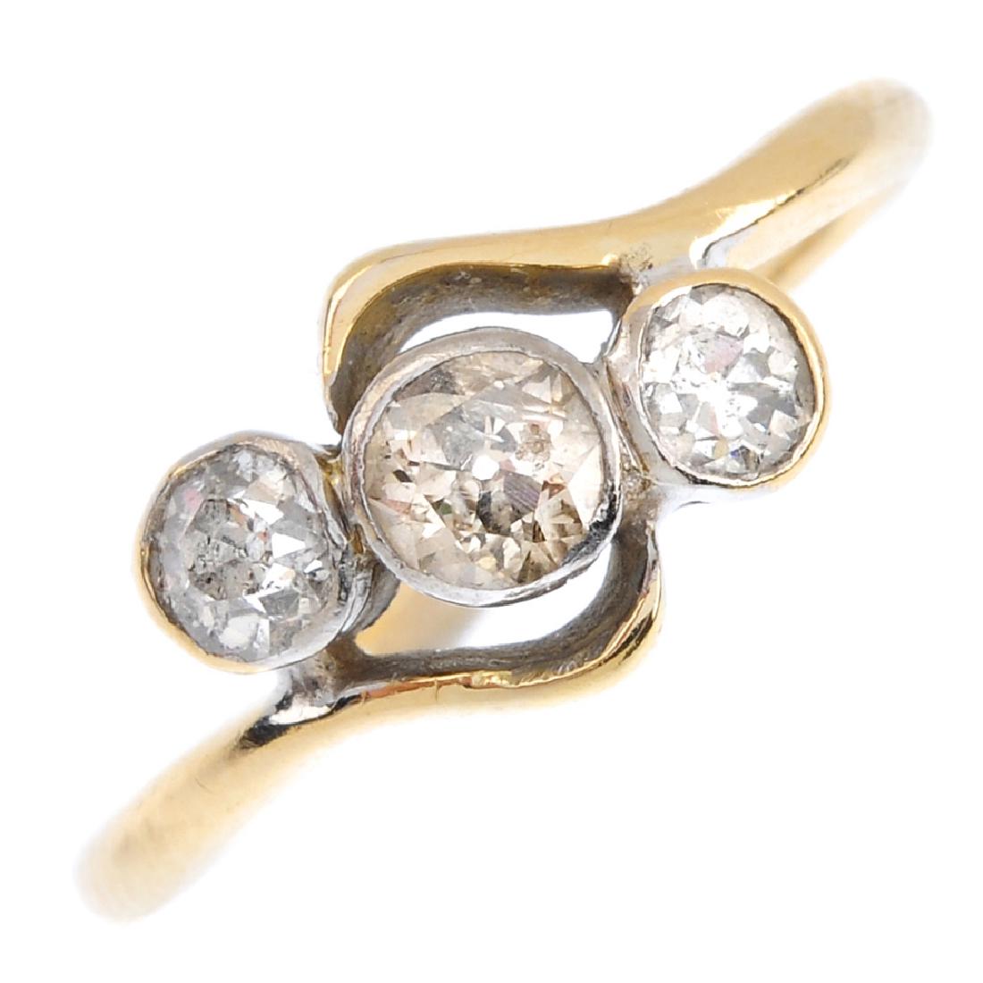 A diamond three-stone ring. The graduated old-cut (1 of 3)