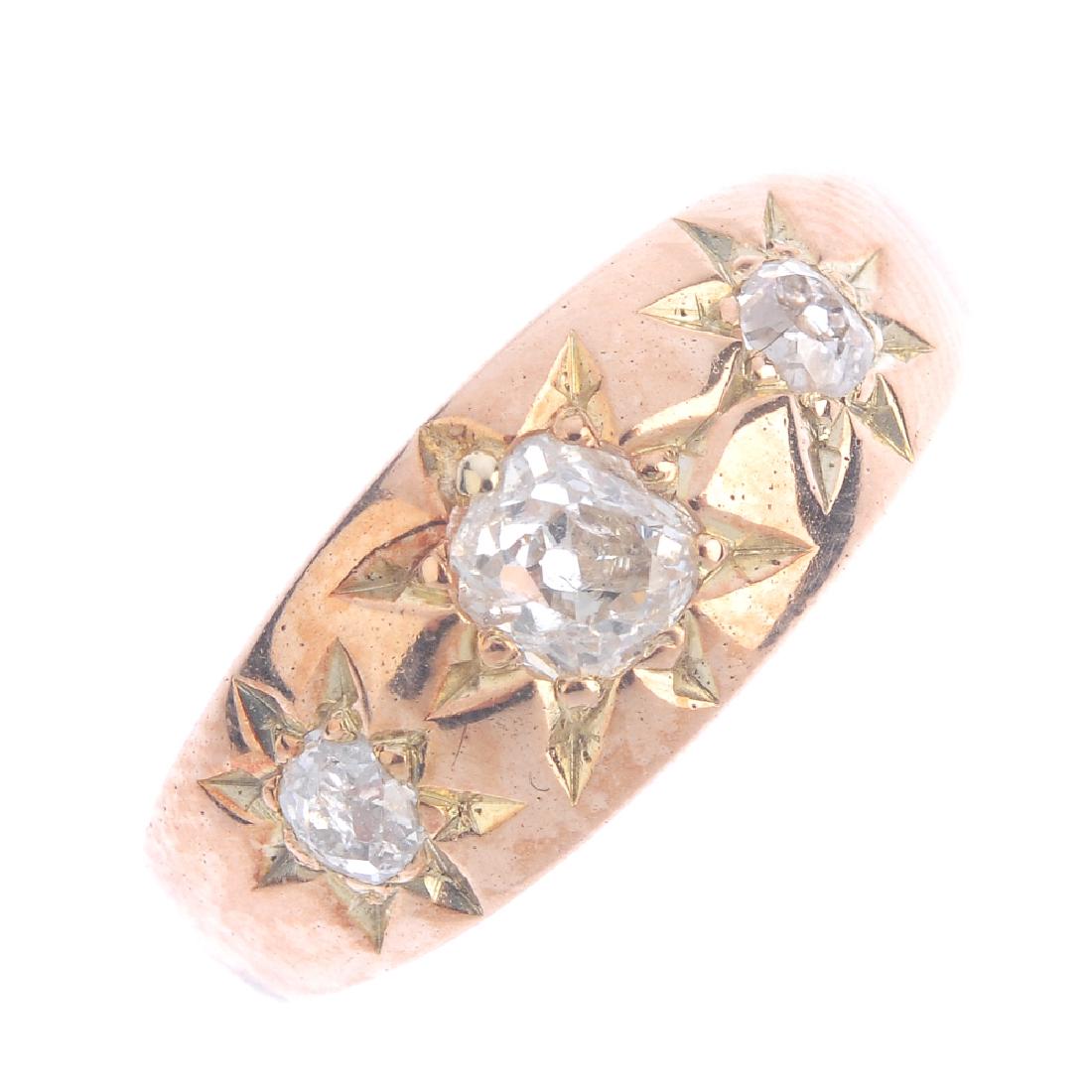 A late Victorian gold diamond three-stone ring. (1 of 3)