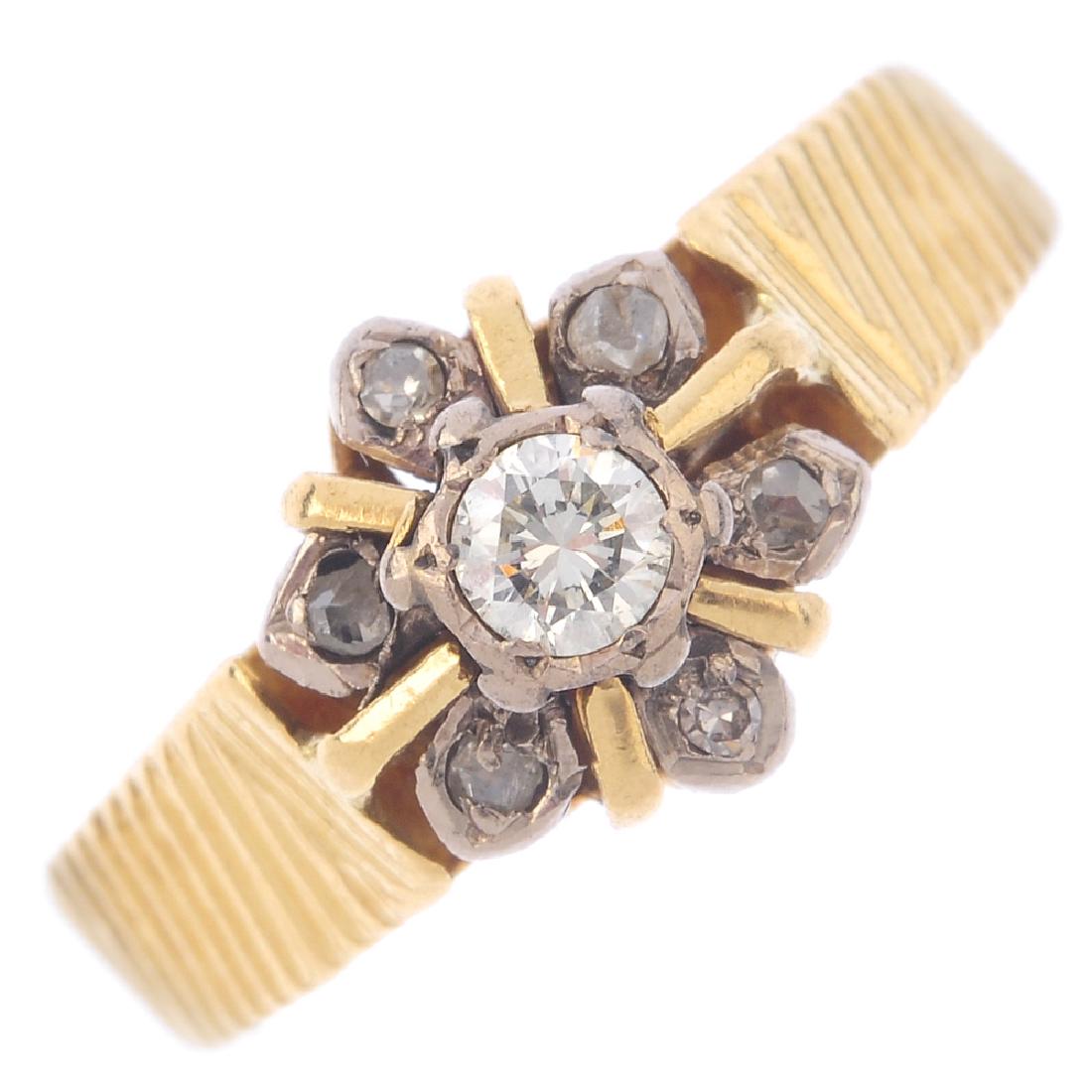 A diamond cluster ring. The old-cut diamond, with (1 of 3)