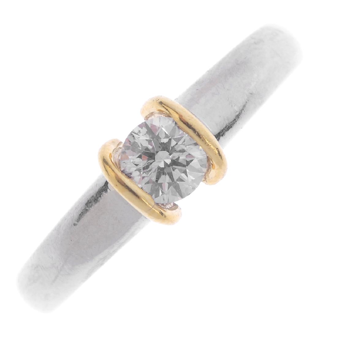 A platinum diamond single-stone ring. Of bi-colour (1 of 3)