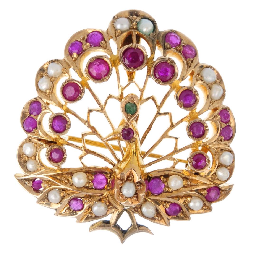 A gem-set peacock brooch. Of openwork design, the split (1 of 2)
