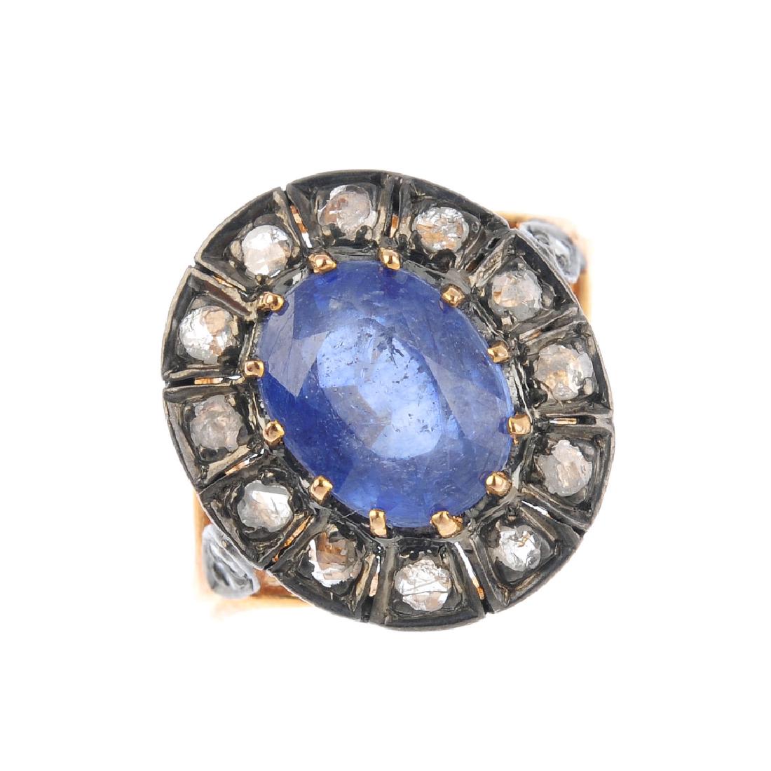 A diamond and glass-filled blue-gem cluster ring. The (1 of 3)
