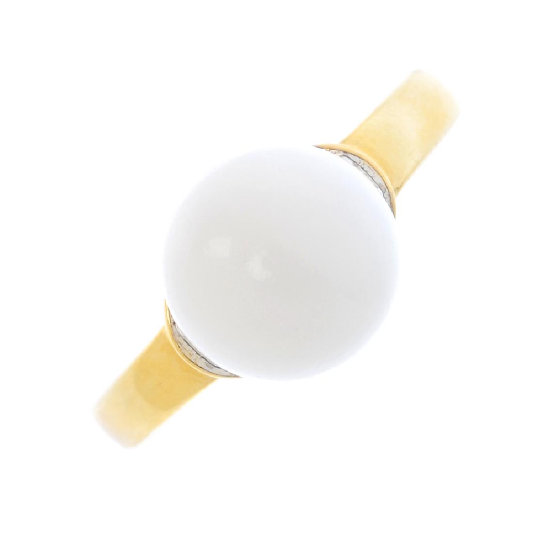 A natural pearl and diamond ring. The pearl, with: A natural pearl and diamond ring. The pearl, with brilliant-cut diamond surround. With report 5777-9344, dated 30th March 2017, from GCS, stating non-nacreous, saltwater, no treatment. Estimated total