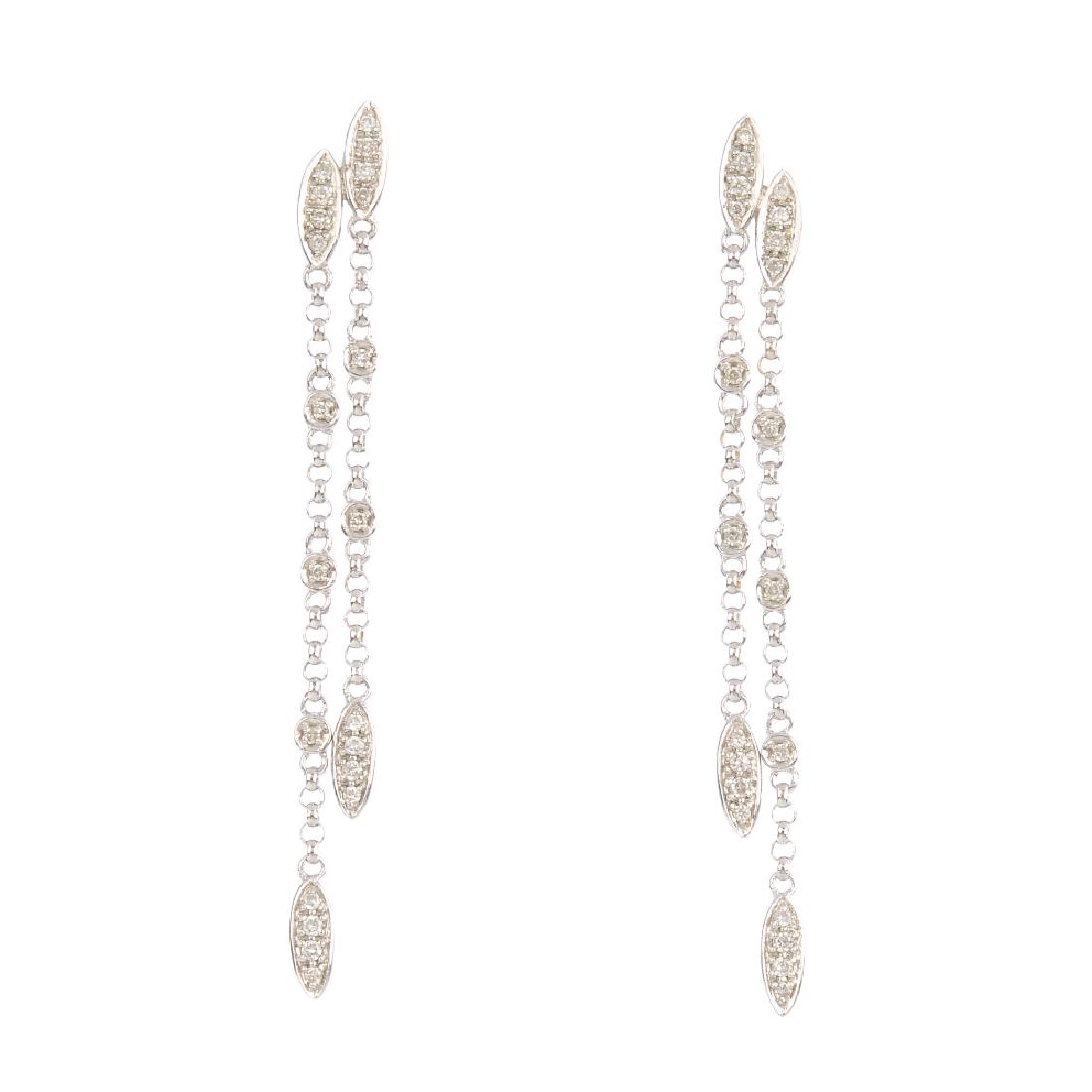 A pair of diamond earrings. Each designed as two (1 of 2)