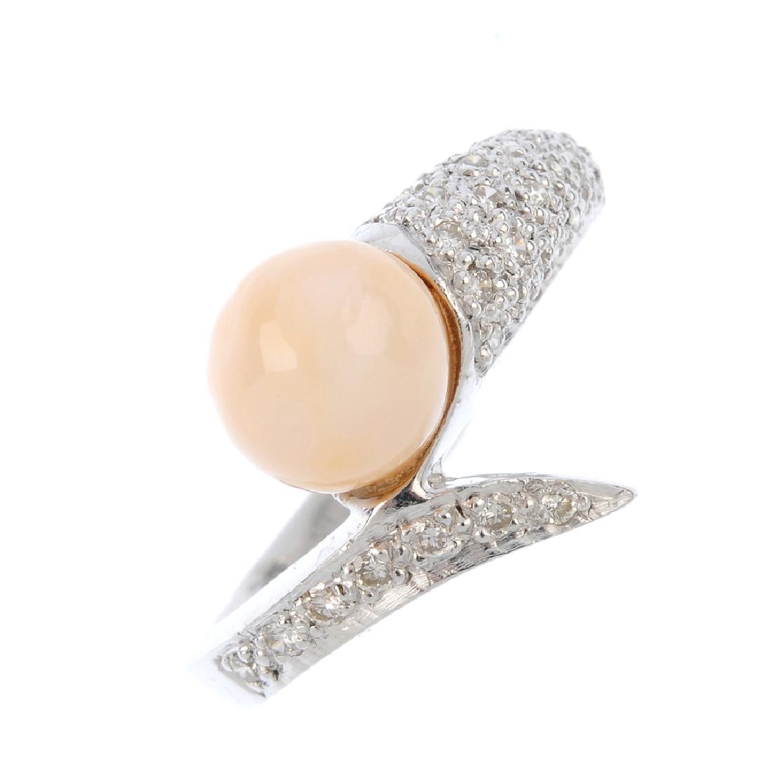 A natural pearl and diamond crossover ring. Of (1 of 4)