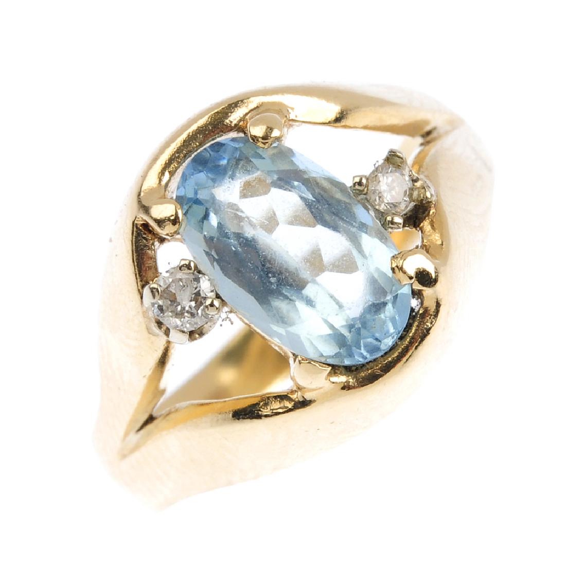 A 14ct gold aquamarine and diamond ring. The oval-shape (1 of 3)