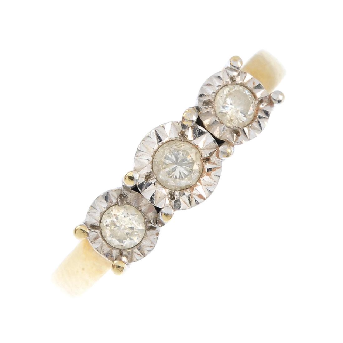 A 9ct gold diamond three-stone ring. The illusion-set, (1 of 3)