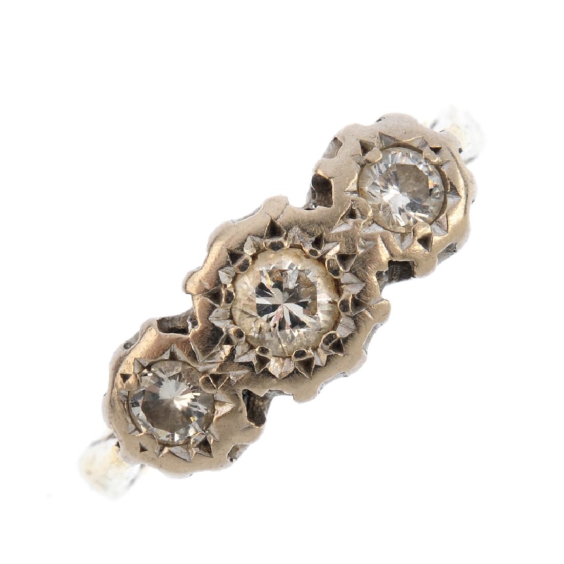 An 18ct gold diamond three-stone ring. The graduated (1 of 3)
