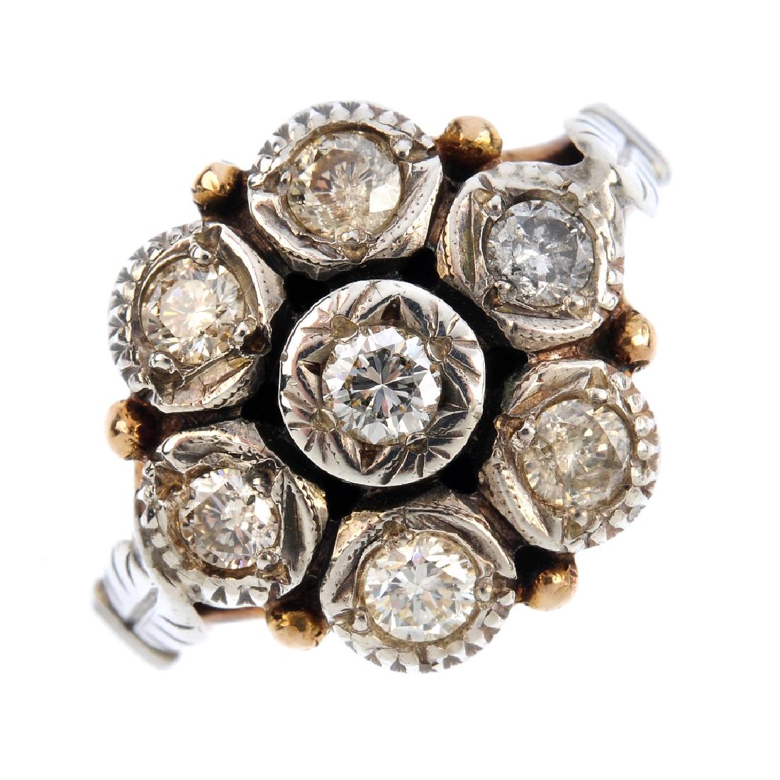 A diamond cluster ring. The brilliant-cut diamond (1 of 3)