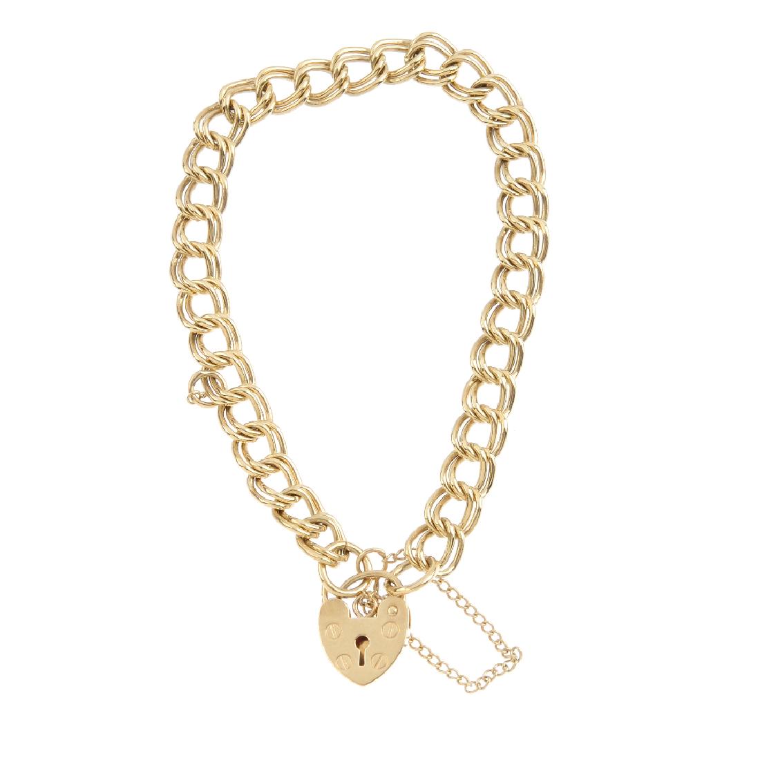 A 9ct gold bracelet. Designed as a double curb-link (1 of 2)