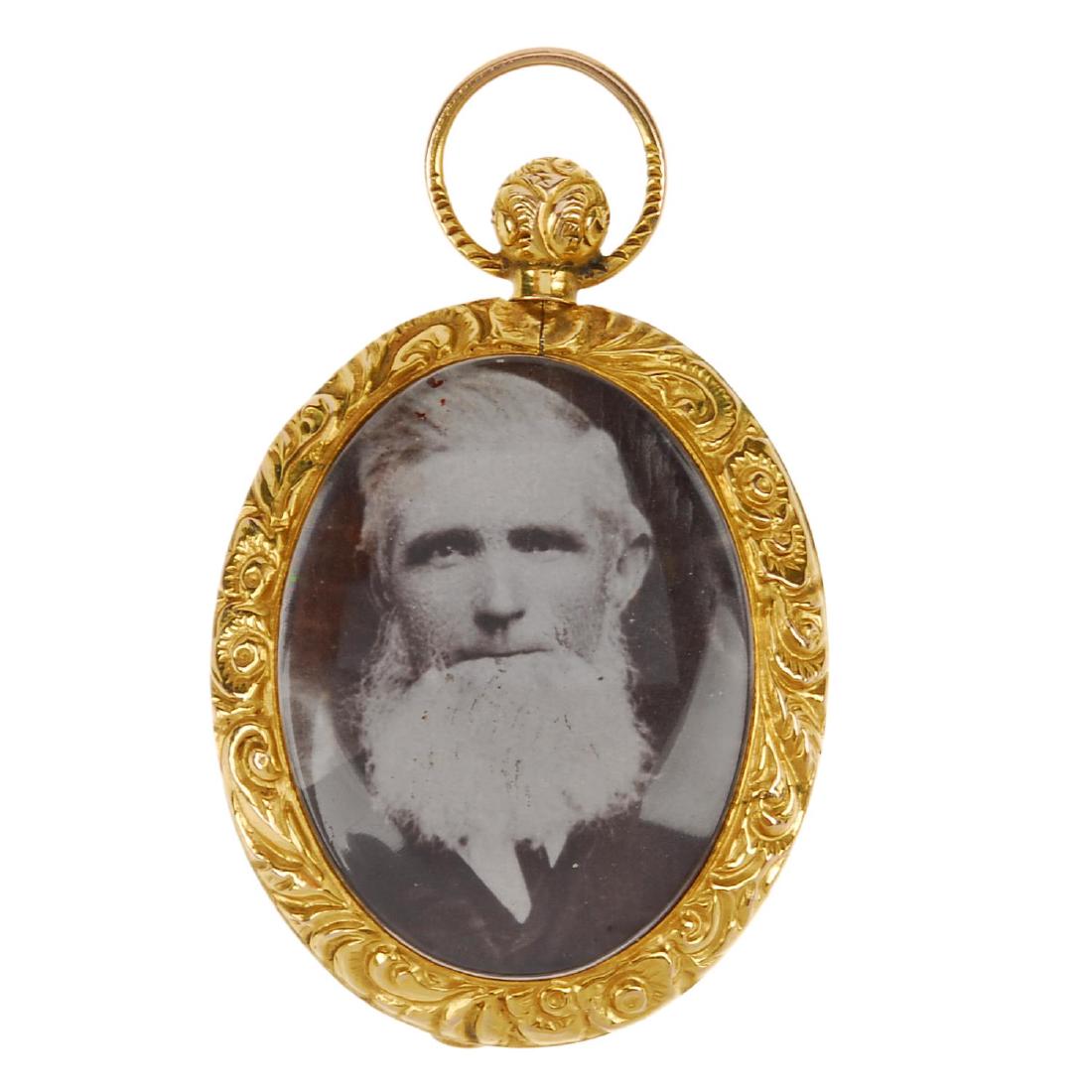 A late 19th century 9ct gold photograph locket. Of oval (1 of 2)