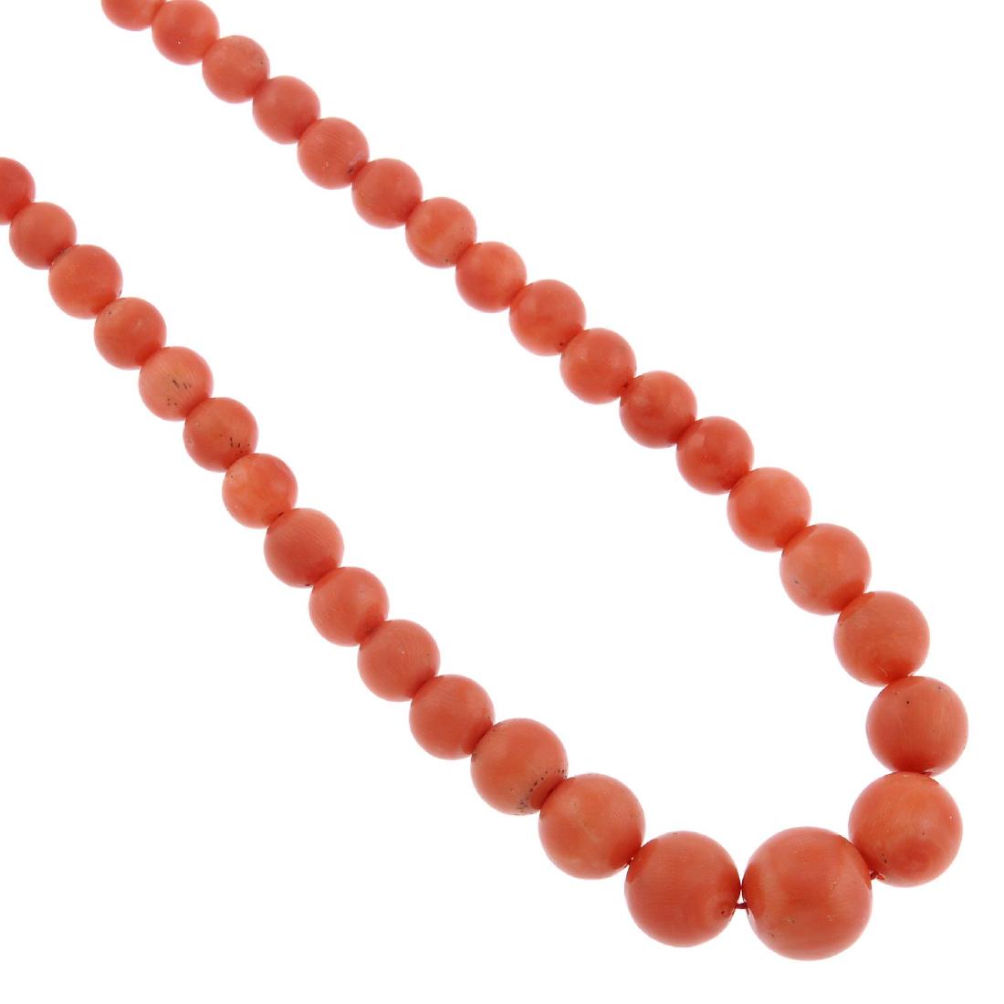 A coral bead necklace. Designed as a single row of (1 of 2)