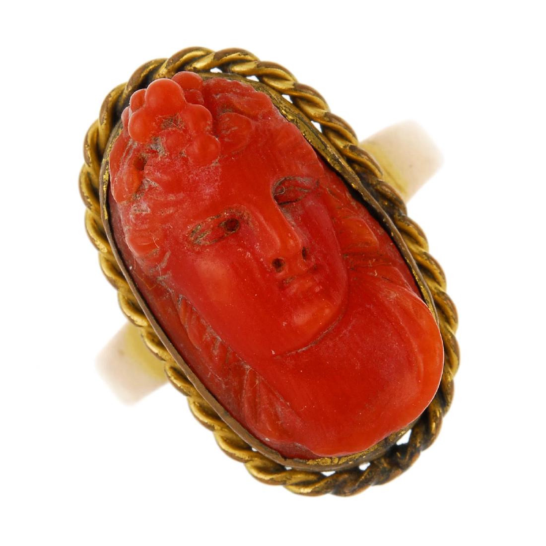 A carved coral ring. The oval shape coral cameo carved (1 of 3)