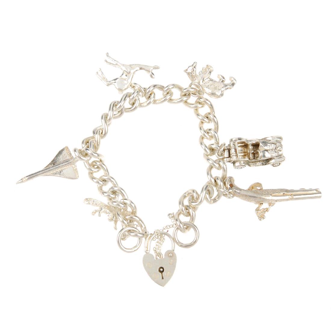 Three charm bracelets. All with varying sized curb-link (1 of 2)