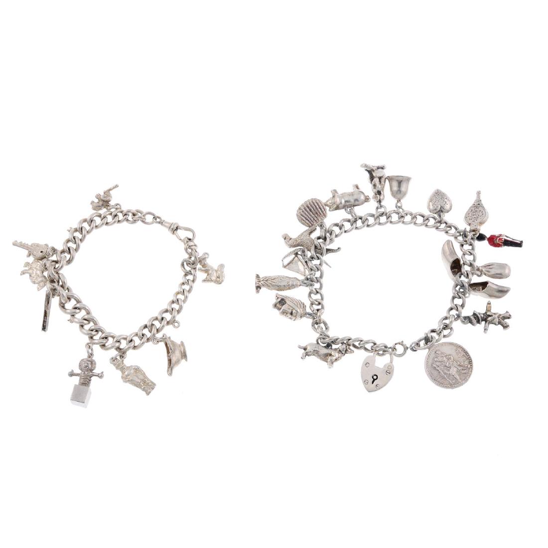 Three charm bracelets. All designed as curb-link (1 of 2)