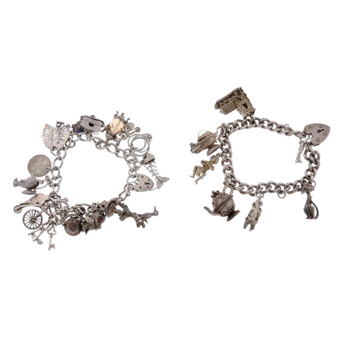 Two charm bracelets. Both curb-link bracelets (1 of 2)