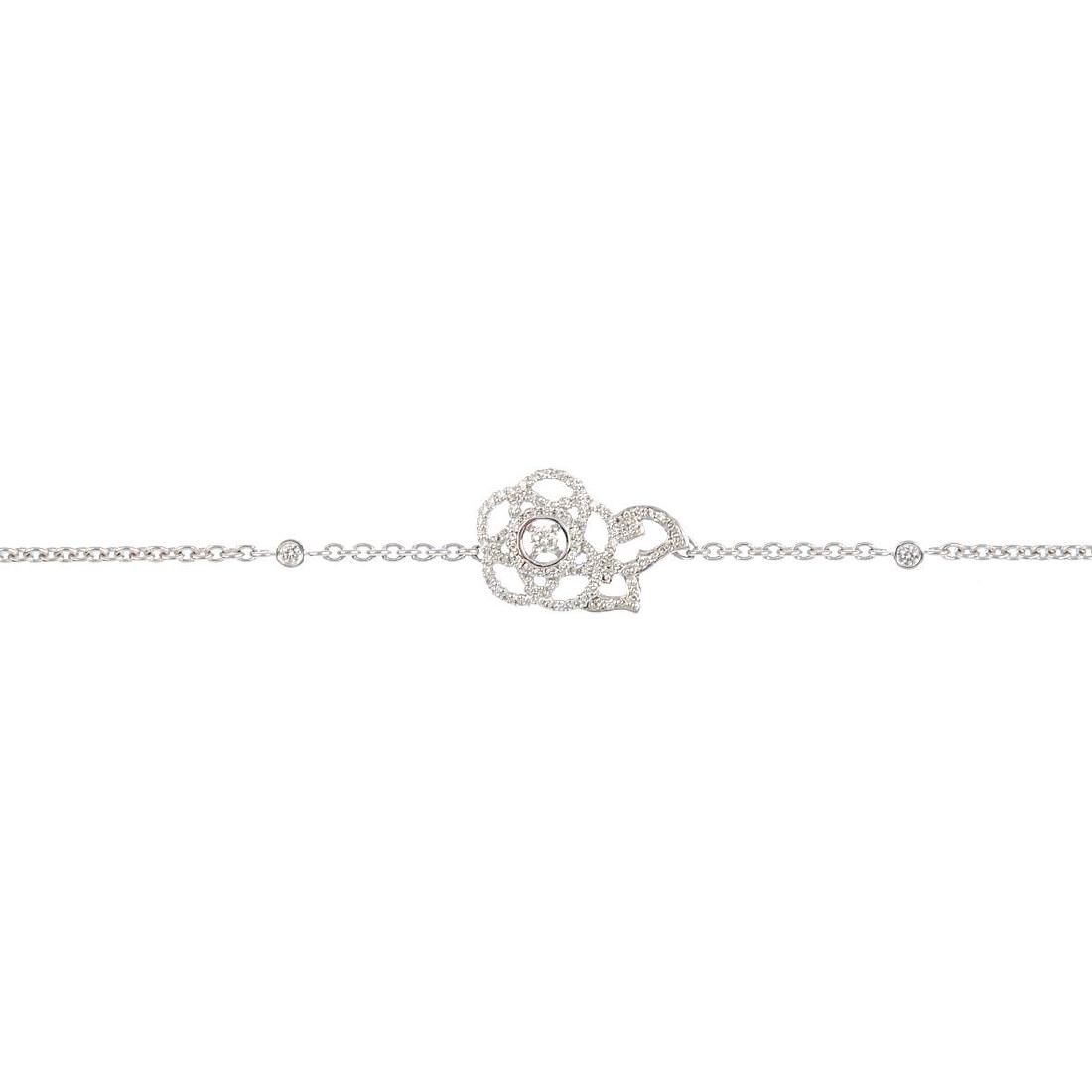 CHANEL - a diamond 'Camelia' bracelet. The (1 of 3)