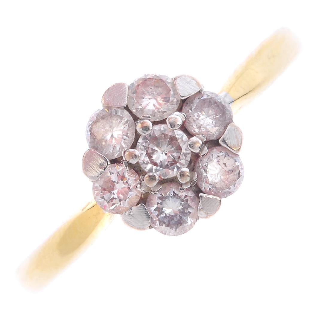 An 18ct gold diamond cluster ring. The brilliant-cut (1 of 3)