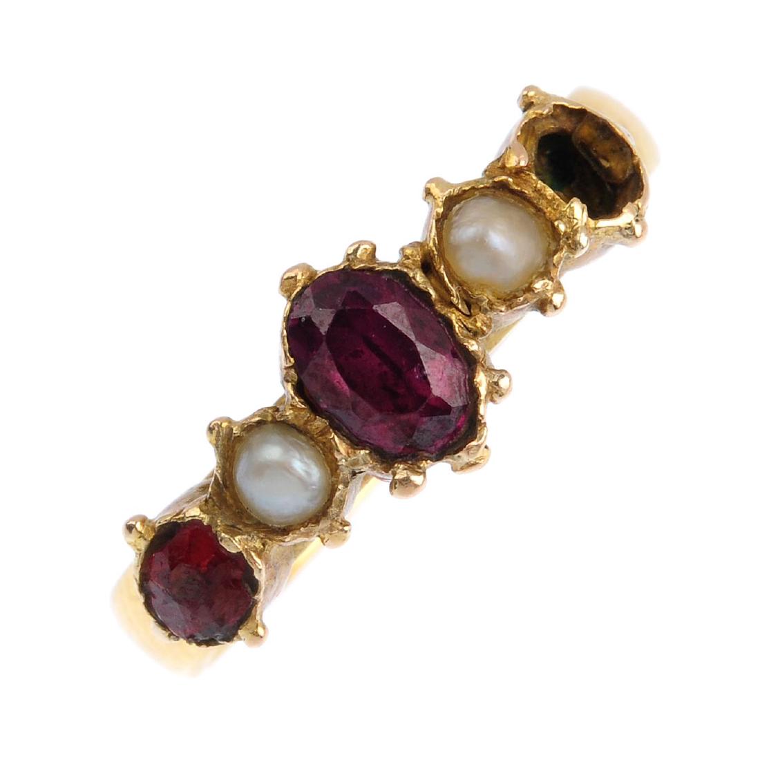 A gem-set five-stone ring. The oval-shape garnet, with (1 of 3)