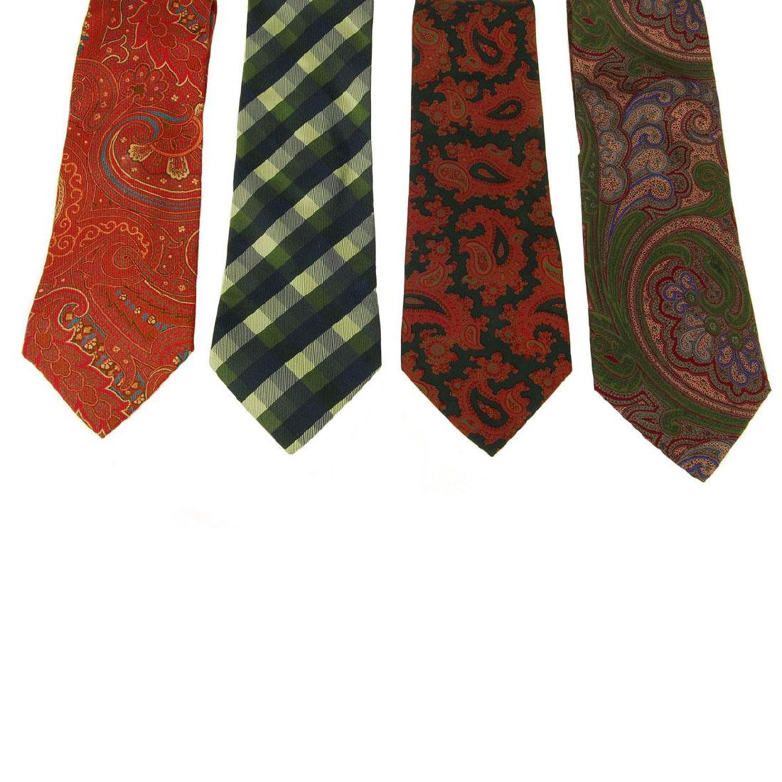 ETRO - four ties. To inlclude three red and green: ETRO - four ties. To inlclude three red and green coloured paisley patterned ties, together with a tonal green chequered tie.