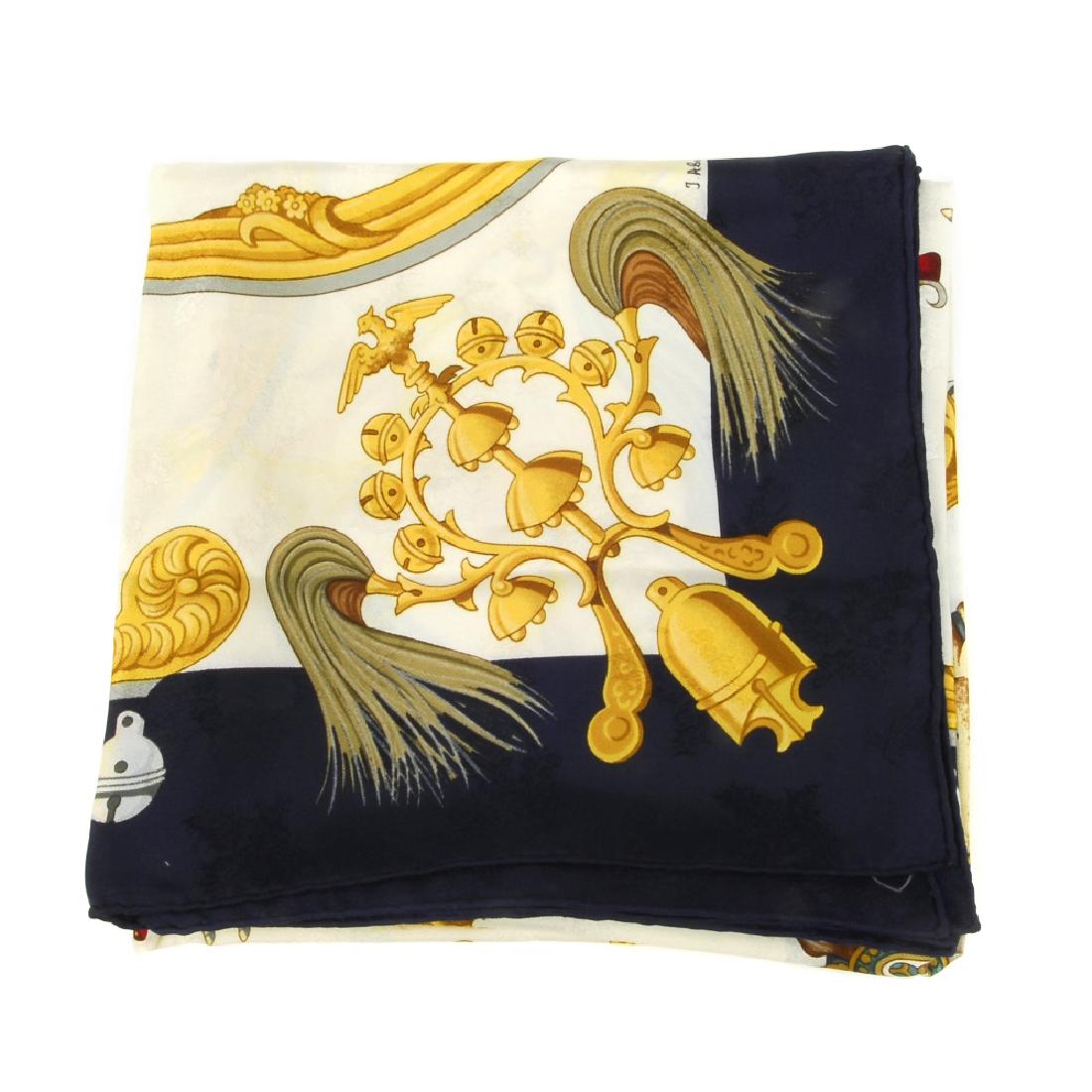 HERMÈS - a 'Plumes Et Grelots' jacquard silk scarf. (1 of 5)