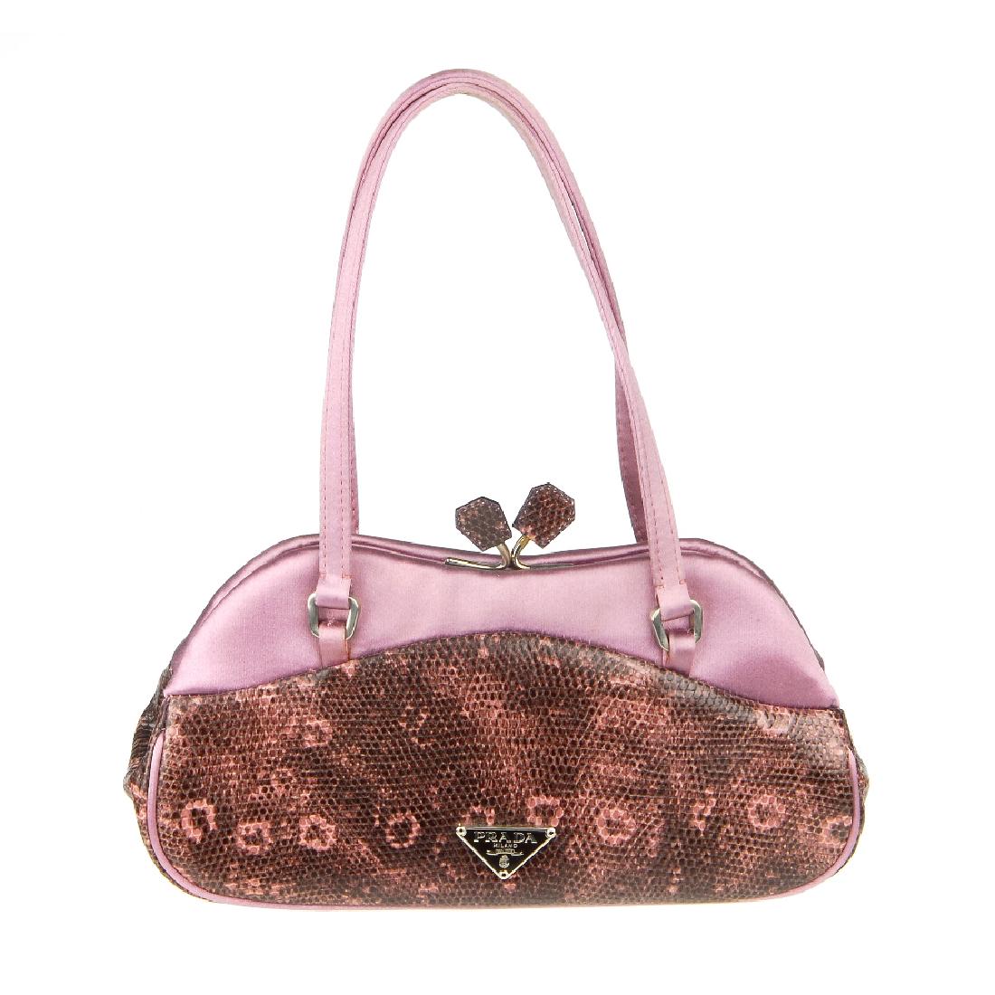 PRADA - a small purple handbag with mirror. Featuring a (1 of 6)