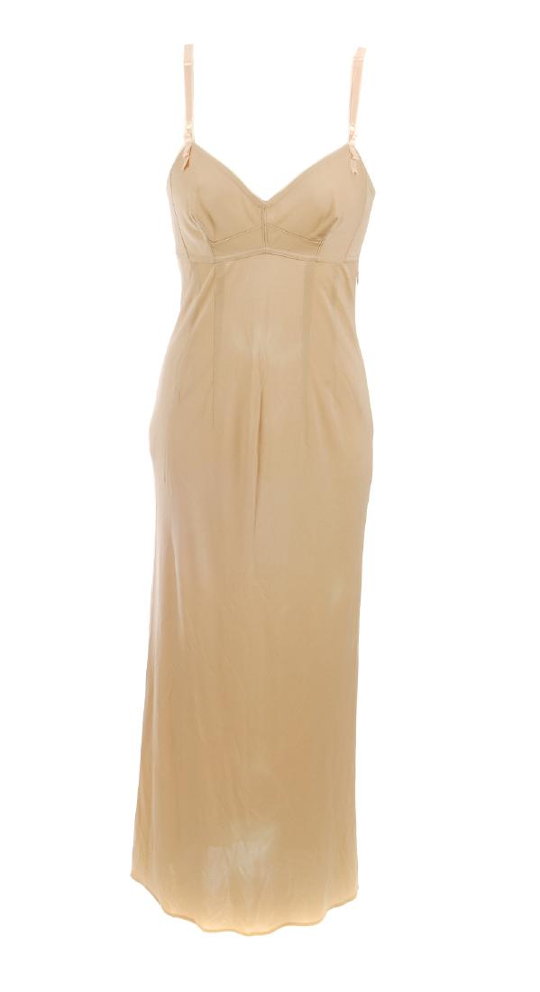 Five items of ladies designer clothing. To include a: Five items of ladies designer clothing. To include a nude full-length strappy dress by Dolce & Gabbana, an ivory Yves Saint Laurent waistcoat, a nude short sleeved shirt by Miu Miu, a white Santacroce