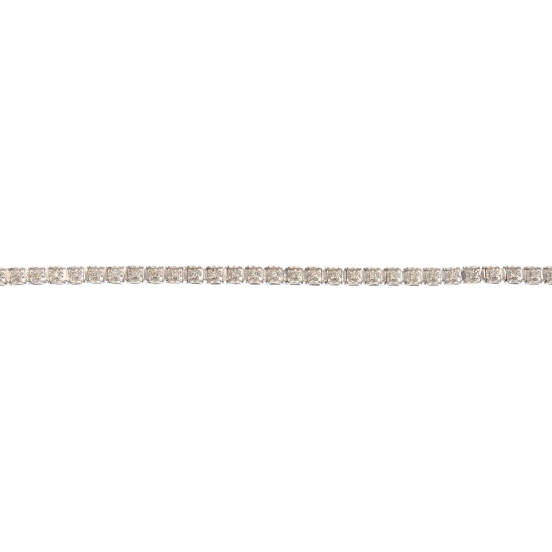 A diamond line bracelet. The brilliant-cut diamonds, (1 of 3)