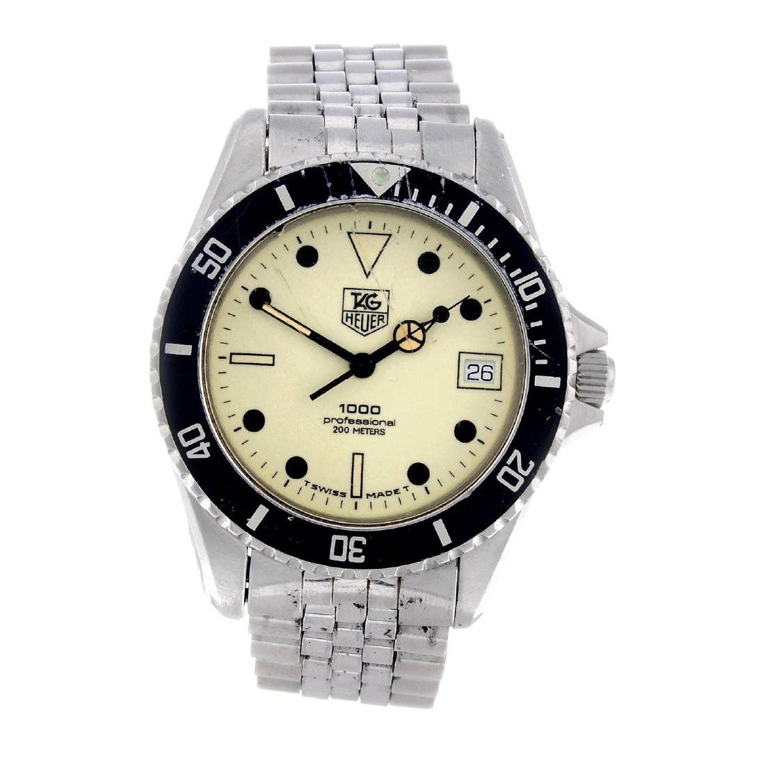 TAG HEUER - a gentleman's 1000 bracelet watch.: TAG HEUER - a gentleman's 1000 bracelet watch. Stainless steel case with calibrated bezel. Numbered 980.113L. Signed quartz movement. Luminous dial. Fitted to a signed stainless steel bracelet with fo