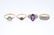 Four gem-set and diamond dress rings. To include a 9ct - 3