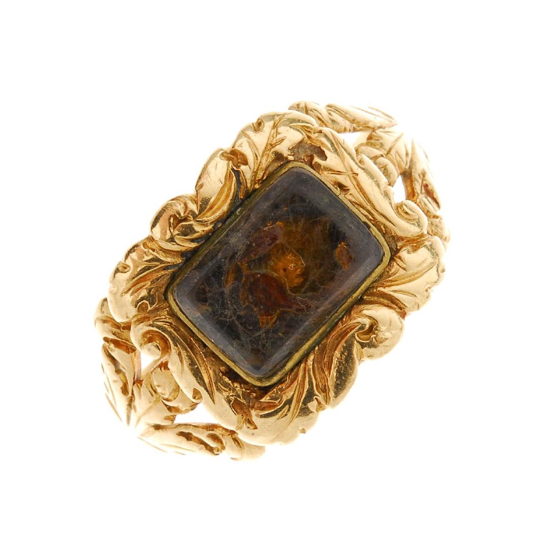 A late Georgian 18ct gold memorial ring. The central (1 of 3)