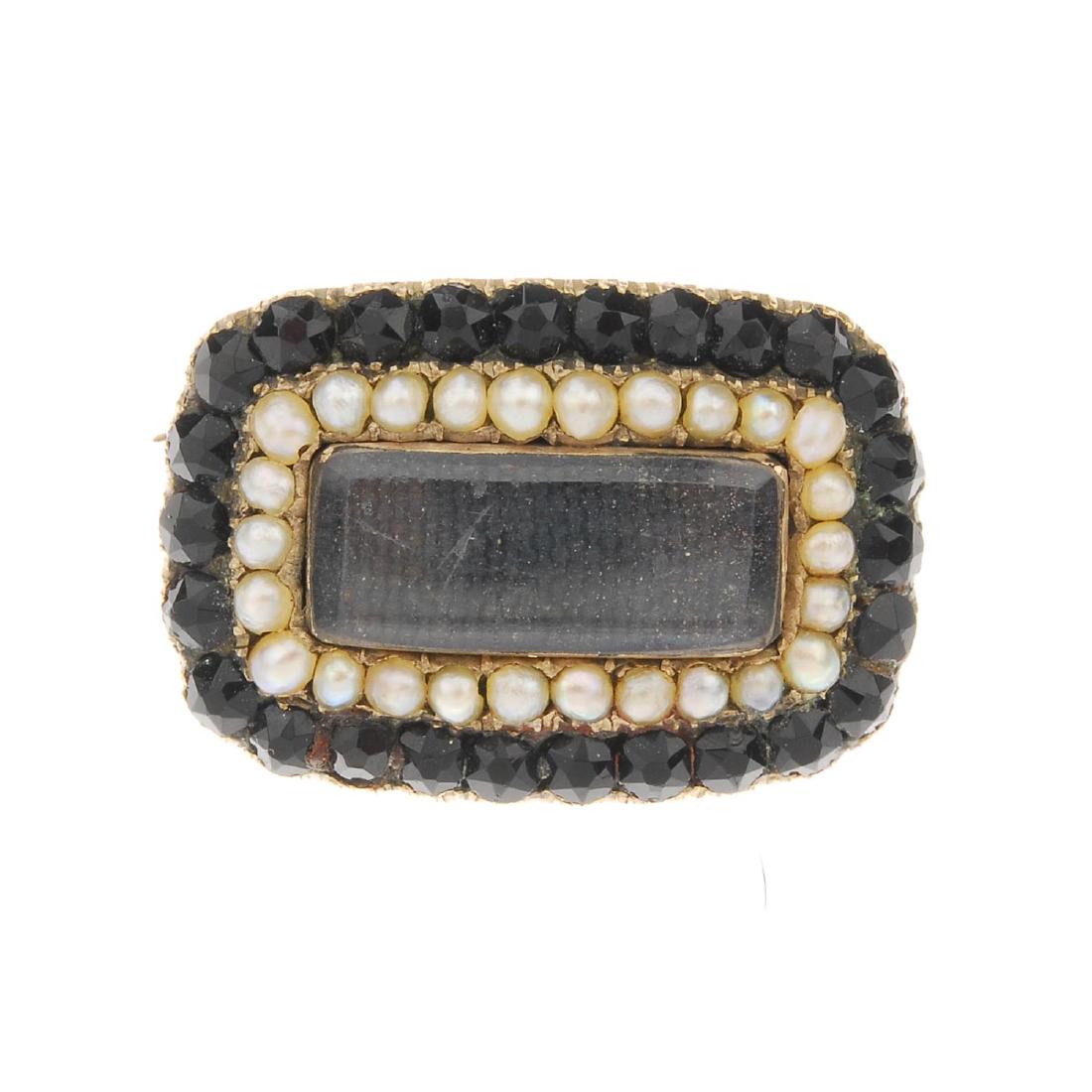 A mid Victorian gold garnet and split pearl memorial (1 of 2)