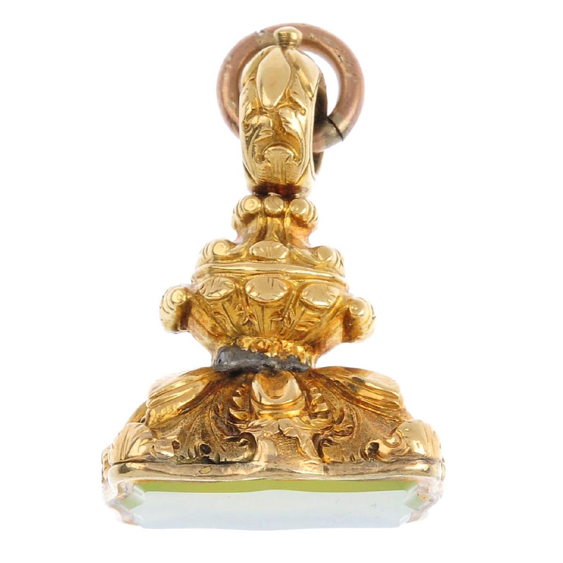 A late 19th century fob. The scalloped green gem panel, (1 of 3)