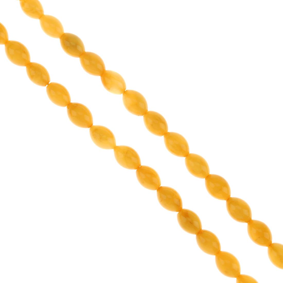 An amber necklace. The single row of amber beads, (1 of 3)