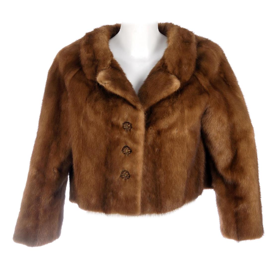 A pastel mink cropped jacket. Designed with a notched (1 of 5)