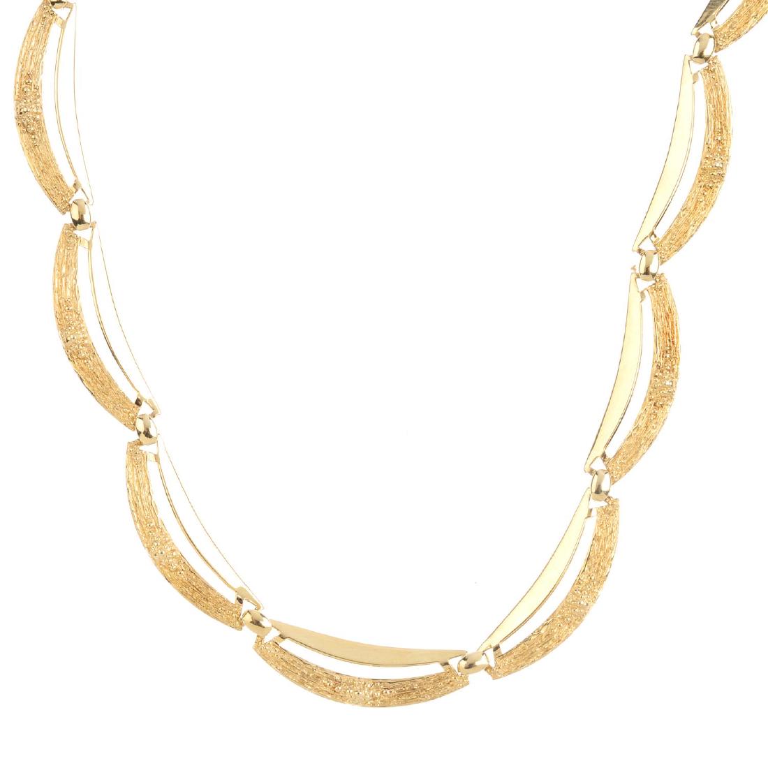 A 1970s 9ct gold necklace. Comprising a series of (1 of 2)