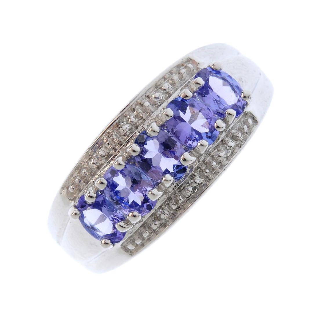A 9ct gold tanzanite and diamond dress ring. The (1 of 3)