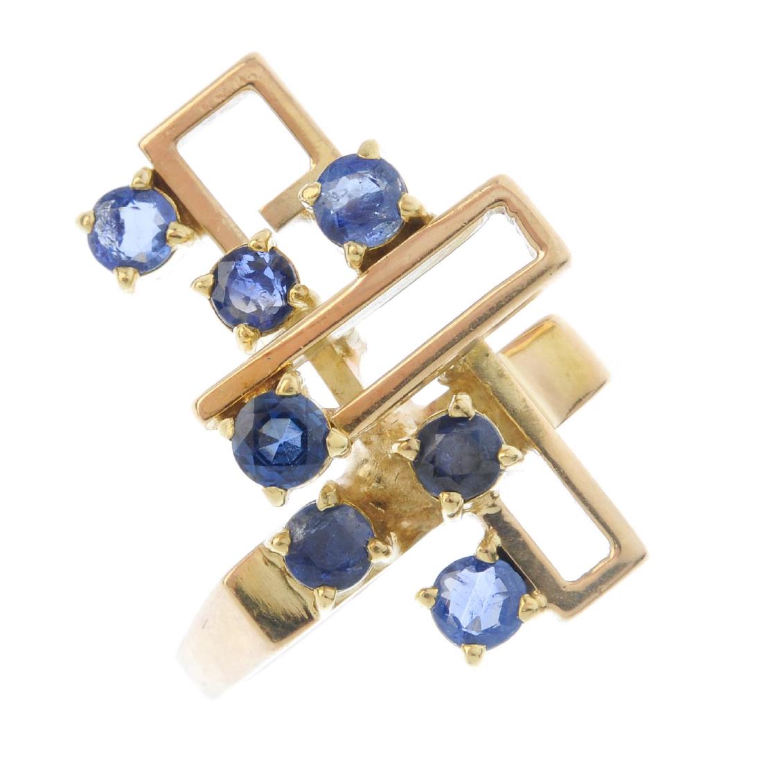 A sapphire dress ring. Of geometric design, with the (1 of 3)